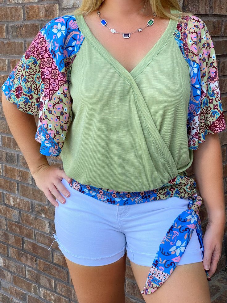 Take a night out with the girls in this open back top. The top is sage with a beautiful blend of colors for the sleeves and bow around waist. Open Back Top, Sage Green, Open Back, The Top, Take A, Night Out, Take That, Green, Color