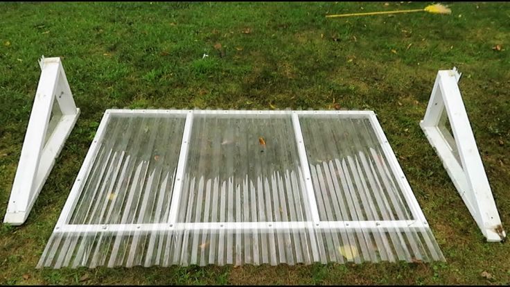 two metal steps sitting in the grass