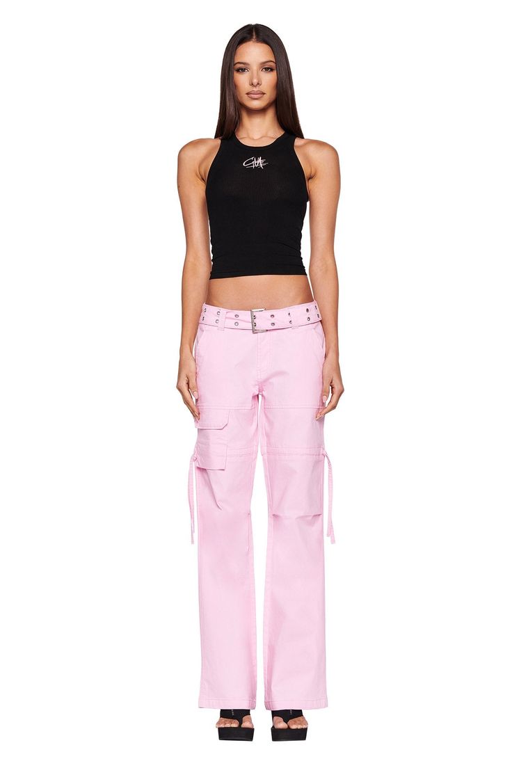 Details Best-selling Naima Cargo Pant is back Baby pink denim jean - Cargo pant style Low-rise waist and relaxed silhouette Double studded belt with silver buckle and eyelets Workable pockets throughout the front and back Featuring workable drawstring at thigh Unlined - This fabric is not sheer Recommended Underwear: Due to the low-mid rise, we recommend wearing this garment with a seamless low-mid brief Size and Fit True to size. We recommend wearing your standard size Low-rise waist - Sits app Iam Gia, Cargo Pant Style, Low Waist Cargo, Pink Cargo Pants, Cargo Pants Style, Baby L, Pink Denim, Denim Pants Women, I Am Gia