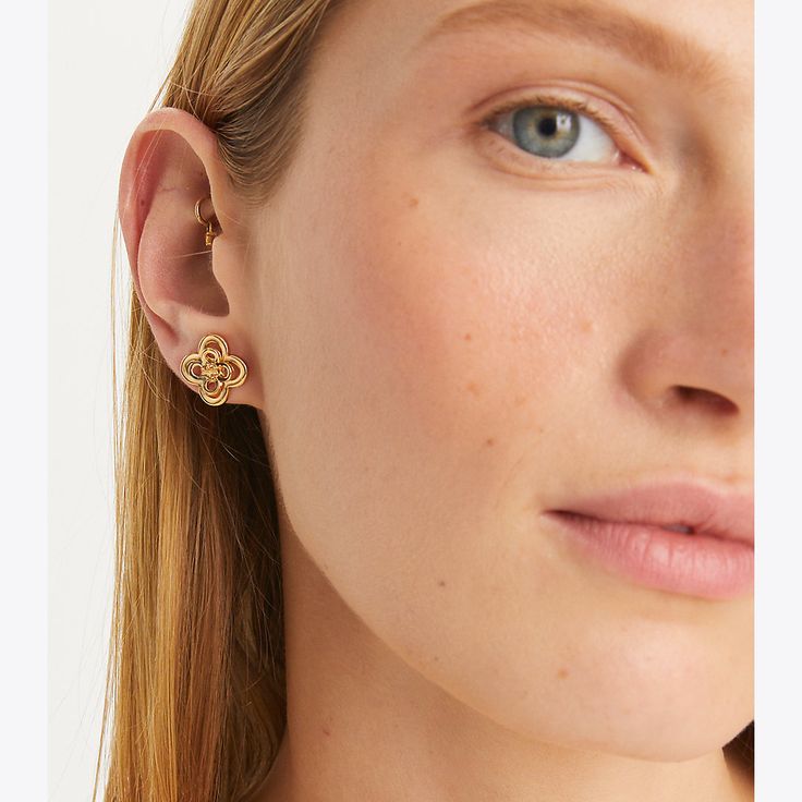 Delicate geometry. Graphic cutouts reinterpret the classic good luck charm on our Kira Clover Stacked Stud. Made for pierced ears. Jersey Turtleneck, Tory Burch Kira, Clover Earrings, Luck Charm, Luck Charms, Pierced Ears, Designer Jewelry, Designer Earrings, Good Luck