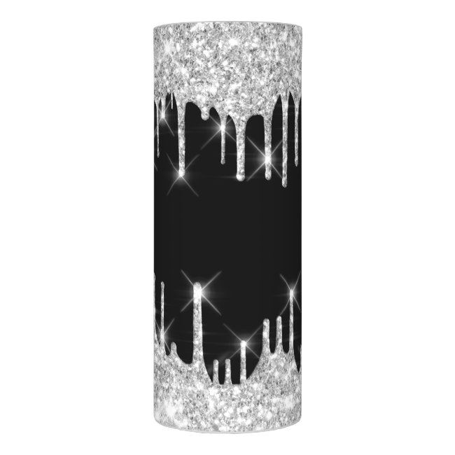 a black and white candle holder with silver sparkles