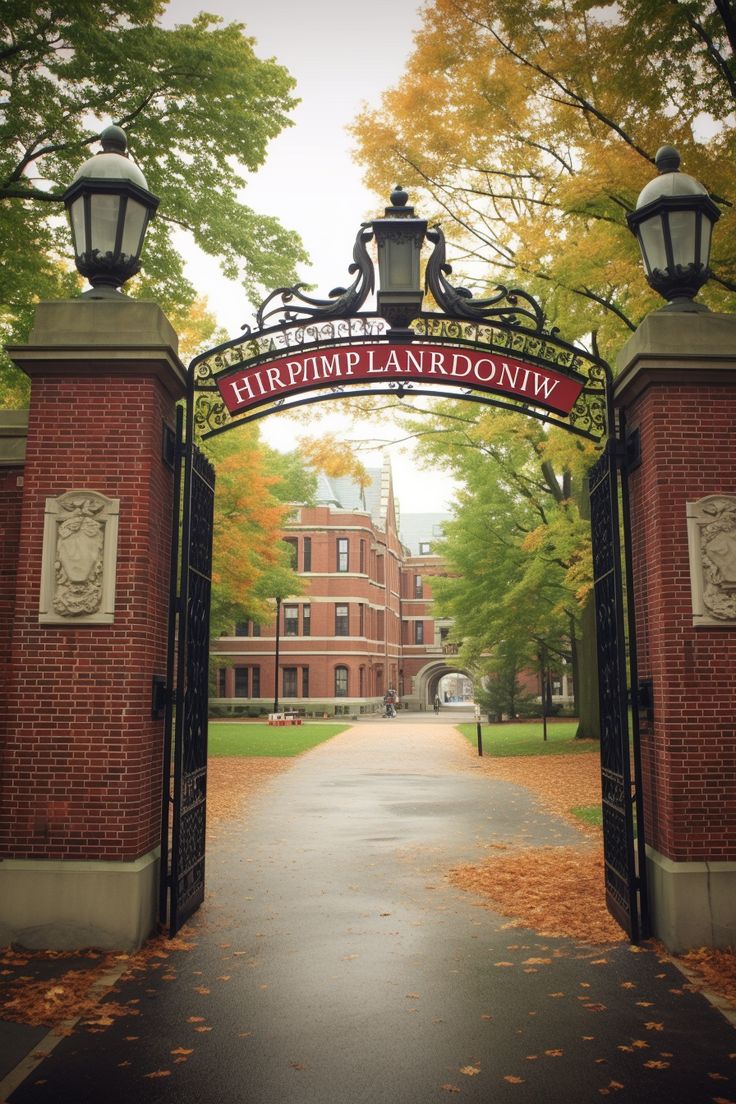 an entrance to the campus with trees in the background