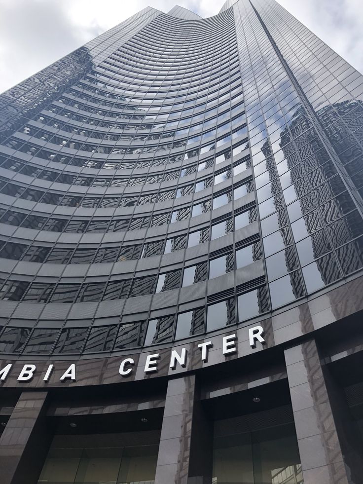 the building is tall and has a sign on it that says, abia center