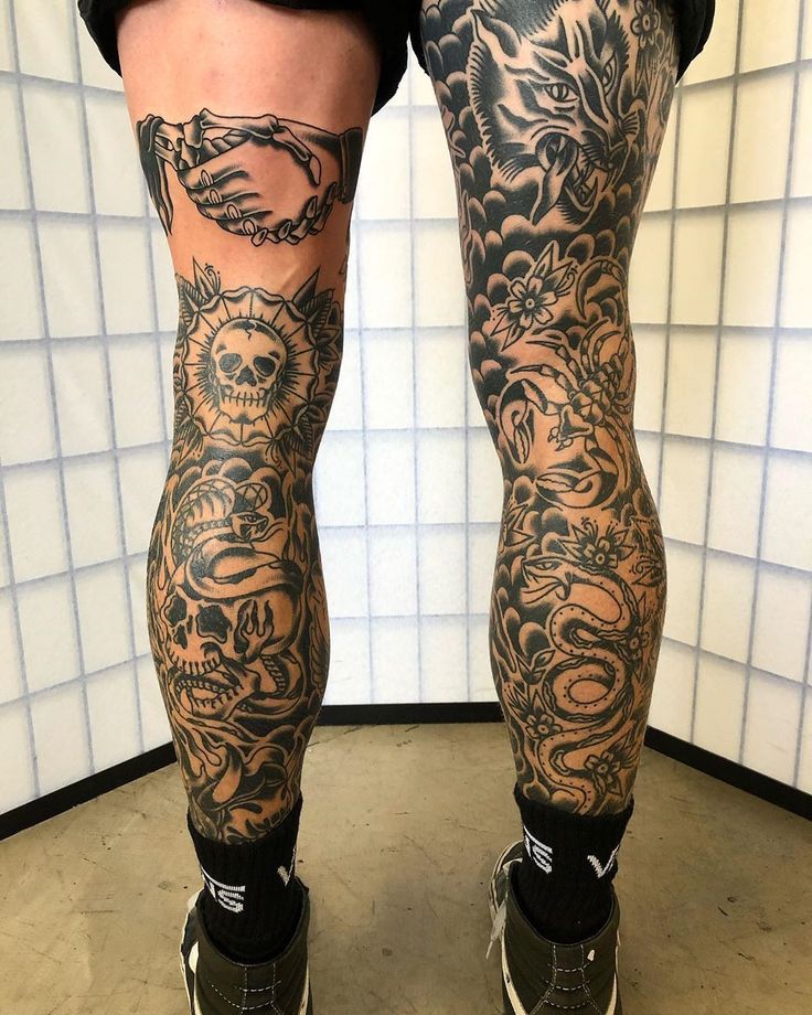 a person with tattoos on their legs