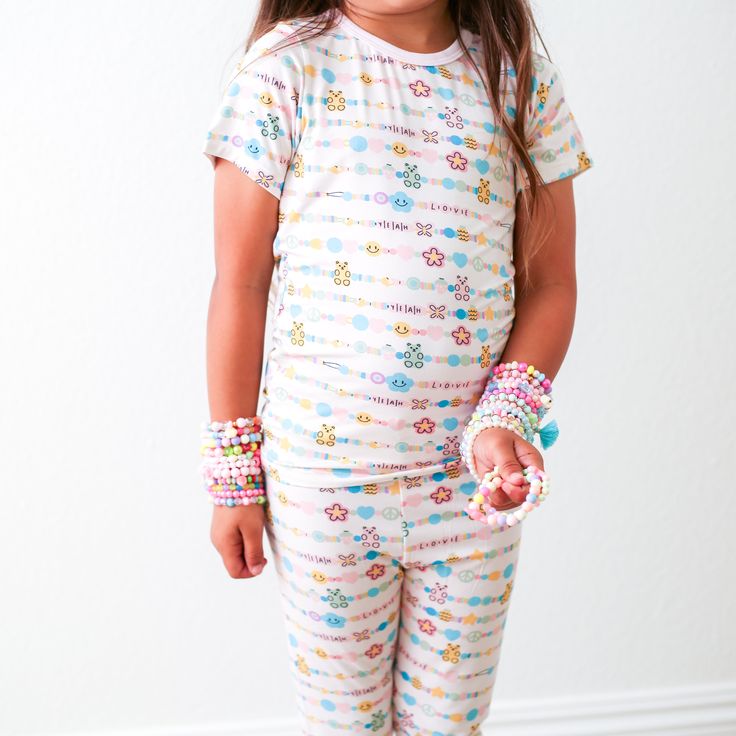 These short sleeve pjs are soft, breathable and super comfy! Made with super soft Bamboo these matching pant and top sets will keep your little one super cozy and snuggly. Short sleeve pajamas for all year lounging. Our pajamas comply with the snug fitting standards for apparel not treated with flame retardants and should be worn snug fitted. 93% Bamboo; 7% Spandex Set includes short sleeve top and pajama pants Wash cold with like colors and fabrics; stays soft wash after wash Tumble dry low or Cozy Cotton Sleepwear With Short Sleeves, Cozy Cotton Short Sleeve Sleepwear, Casual Super Soft Sleepwear For Bedtime, Cozy Relaxed Fit Sleepover Sets, Cozy Short Sleeve Sleepwear, Playful Crew Neck Sleepover Sets, Playful Multicolor Sleepwear For Loungewear, Playful Crew Neck Sets For Sleepover, Cute Multicolor Sleepwear For Loungewear