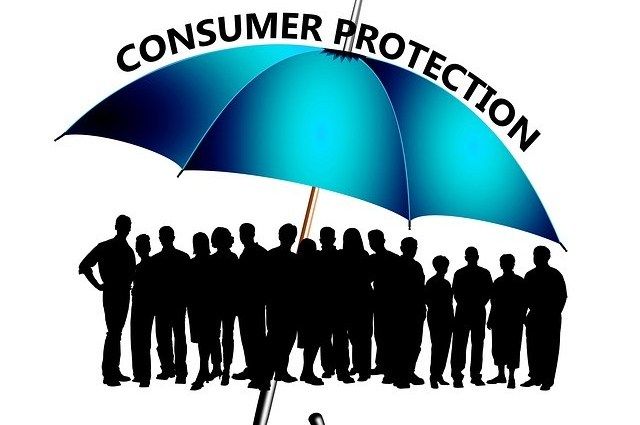 a group of people under an umbrella with the words consumer protection written on it in black