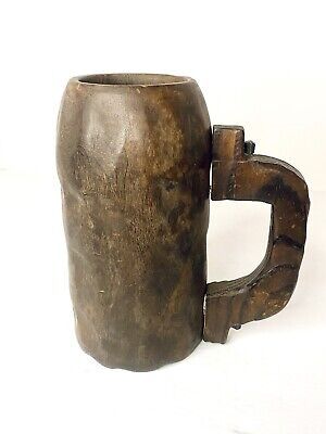 an old wooden mug with handle on white background