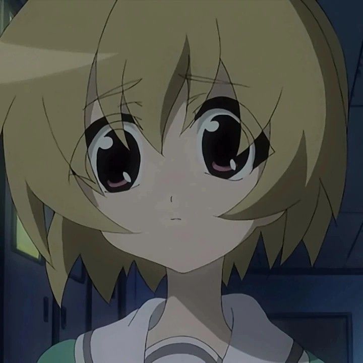 an anime character with big eyes and blonde hair looking at the camera while standing in front of a door