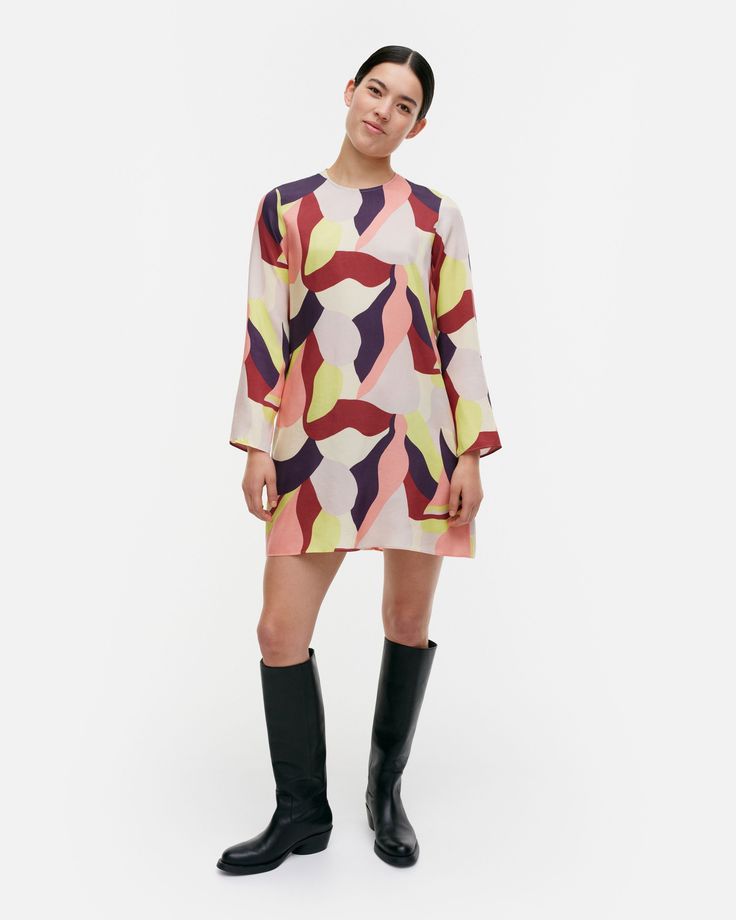 The Kehä dress is made of a lyocell and viscose blend, and it has a slim, A-line fit. The dress features the Kamelia pattern, and it has an O-neck with a concealed zipper in the back neckline. The dress has long, slim sleeves, side seam pockets, and central front and back seams.

This product contains 38% recycled viscose.

Our dresses are sewn using the whole width of the fabric, and therefore their appearance may vary. Each item is unique.

The abstract Kamelia (camellia) print combines organic shapes with a mesmerizing, layered rhythm. A master of many different styles and techniques, Fujiwo Ishimoto created countless hit designs for Marimekko over a period of four decades. Fujiwo Ishimoto, Merimekko Bedding, Marimekko Outfit, Uniqlo Marimekko Dress, Marimekko Tablecloth, Vintage Marimekko, Organic Shapes, Cloth Bags, Sales Gifts