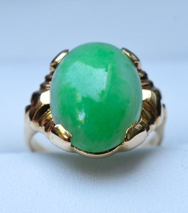 "Category Type: Rare Fine Jewelry Metal Purity:14K Yellow Gold Ring Size US: 4 3/4 Center Stone: Highest Quality Grade \"AAA\" Untreated Jadeite Jade Stone Creation: Grade \"A\" Finest Untreated Imperial Quality Jadeite Jade Additional Stones: Natural Diamond Accent Jadeite Stone Size: 6 Carat - 15mm x 12mm Ring Total Weight: 4.7 grams Condition: Preowned / Like New" Heirloom Green Emerald Oval Cabochon Ring, Heirloom Green Oval Cabochon Emerald Ring, Green Opal Oval Ring In 14k Gold, Classic Green Oval Opal Ring, Classic Green Cabochon Emerald Ring, Heirloom Green Oval Opal Ring, Green Oval Opal Ring For Formal Occasions, Classic Green Emerald Ring For Collectors, Classic Green Opal Cabochon Ring