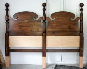 two wooden headboards are next to each other on the floor in front of a door