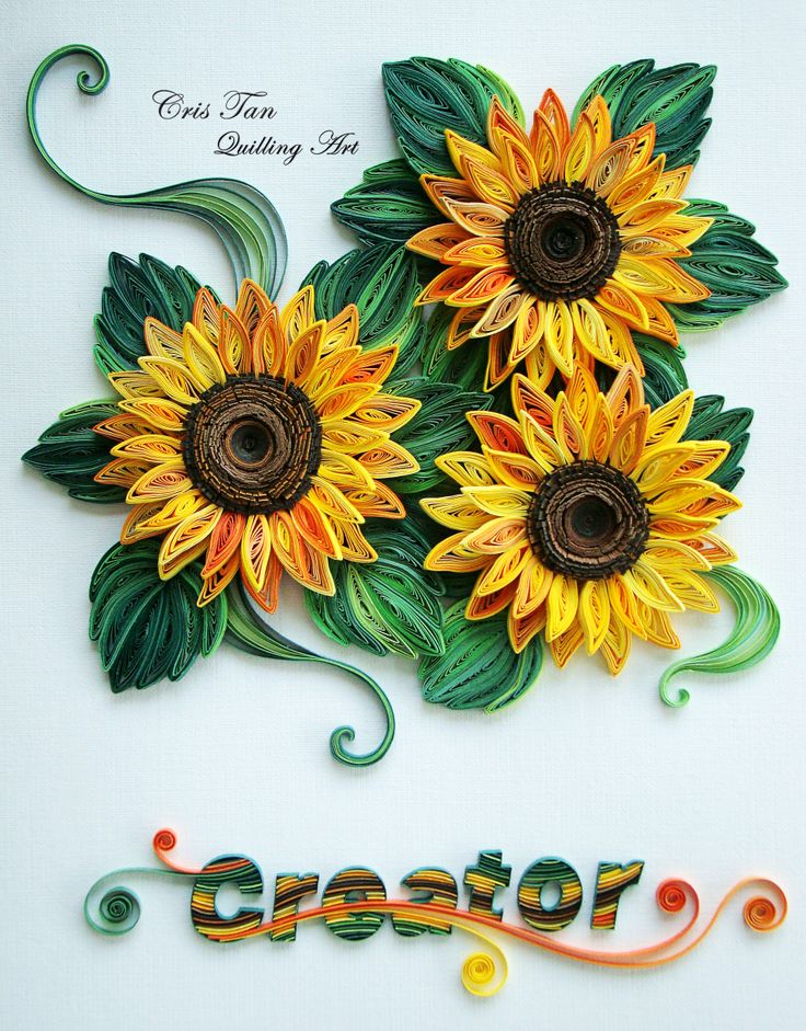 some very pretty sunflowers with the word creator written in it's center