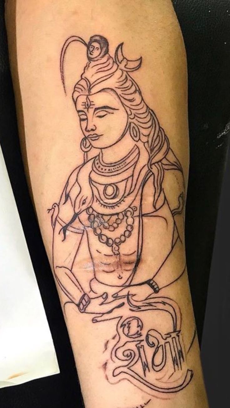 a person with a tattoo on their arm that has an image of the hindu god