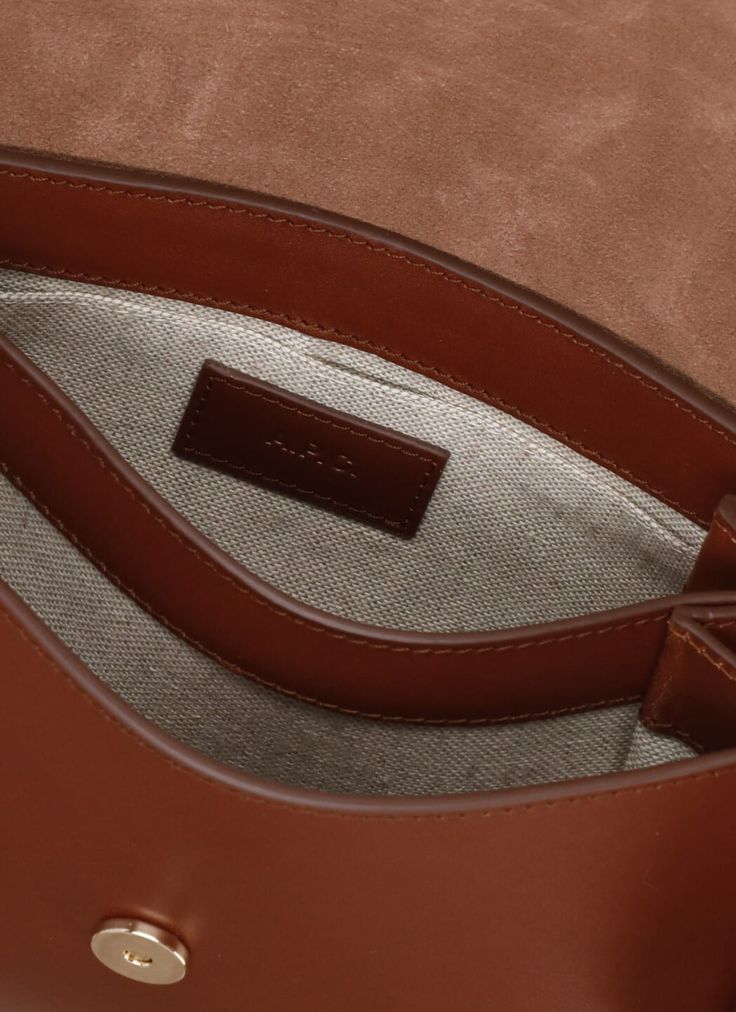 100% Cow leather Textured Leather Top Handle Flap Bag, Designer Brown Flap Bag With Top Handle, Designer Top Handle Saddle Bag For Everyday, Designer Brown Top Handle Flap Bag, Luxury Everyday Top Handle Saddle Bag, Luxury Brown Saddle Bag, Cognac Saddle Bag For Formal Occasions, Luxury Saddle Bag With Top Handle For Everyday, Designer Smooth Grain Crossbody Shoulder Bag