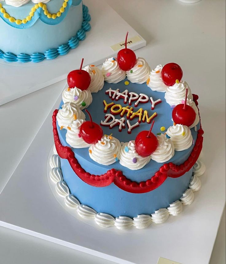 two birthday cakes with cherries on them and the words happy today written in frosting