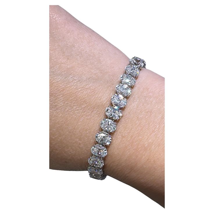 Daniella Design SKU: 127778 Oval cut diamond riviera line tennis bracelet is absolutely amazingly crafted in luxurious Platinum and made with 33 oval-cut diamonds of each GIA-certified stone 23.19carats! True fit for a queen. Everyone will gasp with a thrill when seeing it on her wrist! Metal: Platinum Diamond Weight: (33) Oval Cut Diamonds of 23.19ct t.w. Certified: All GIA-certified diamonds Diamond Details: D - F color, SI+ clarity Dimension: Width 6mm L: 17.7cm 0.70 OV DSI2 GIA#7402939763 0. Bracelet Tennis, Oval Cut Diamond, Bracelet Crafts, Gia Certified Diamonds, Tennis Bracelet, Oval Cut, Metallica, Diamond Cuts, Platinum