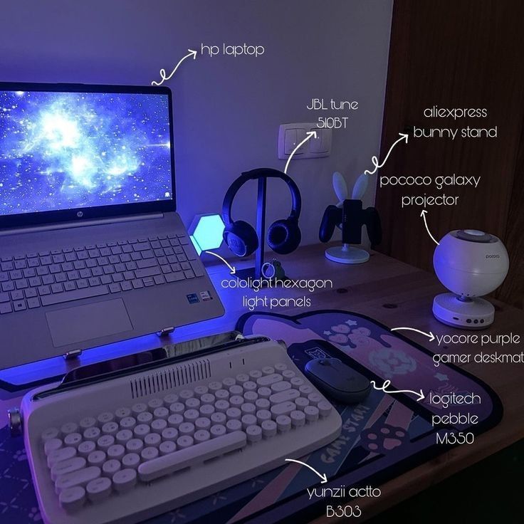 an open laptop computer sitting on top of a desk next to a keyboard and mouse