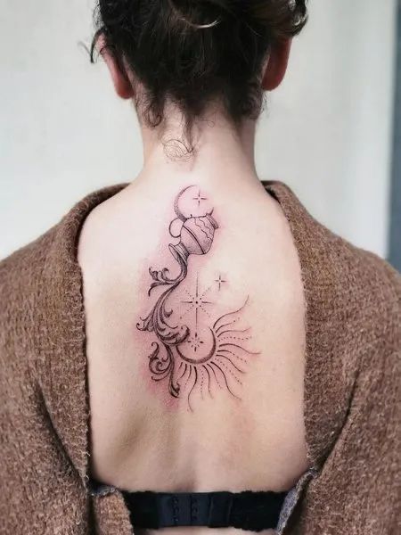 a woman with a tattoo on her back