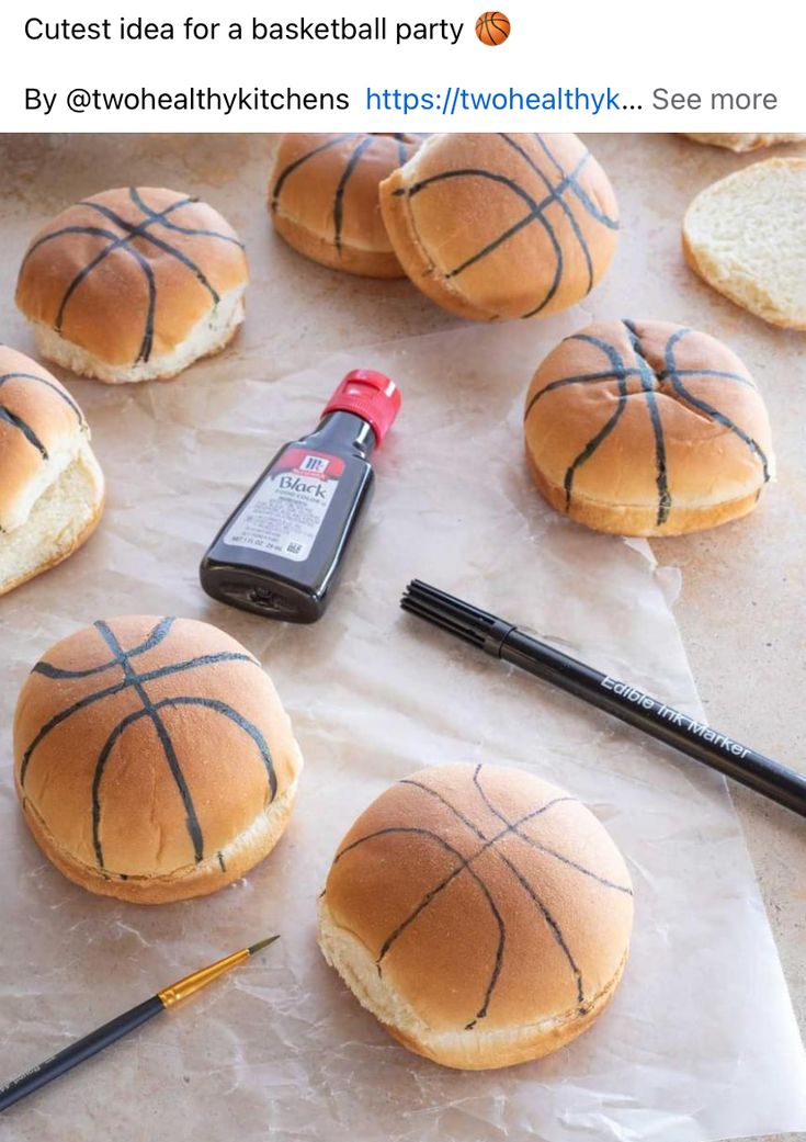 several basketball buns are on the table with pens and pencils next to them