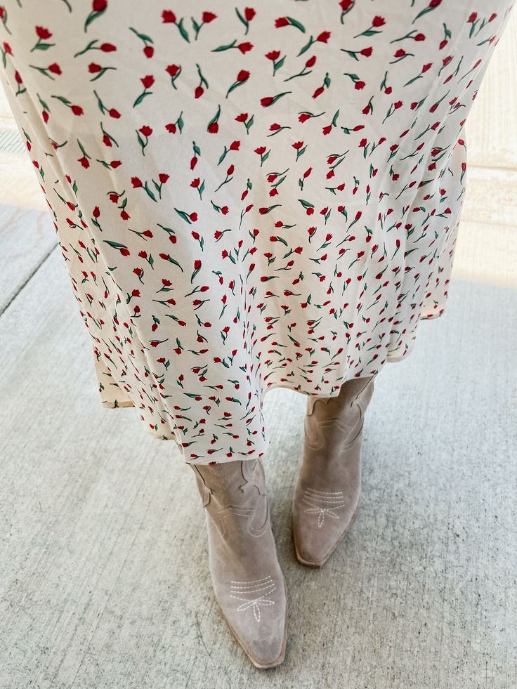 Put some flower power into your wardrobe with our Tammy Floral Midi Skirt! This ivory skirt features a red micro floral print and a comfortable elastic waistband. Perfect to pair with both graphic tees and sweaters, this midi skirt will add a playful touch to any outfit. Product Details: Measurements: WAIST small 13" medium 14" large 14.5" LENGTH small 34" medium 35" large 36" 100% polyester midi length elastic waist fully lined super comfortable model wearing size small model stats: size 4, 5'5 Red Skirt With Elastic Waistband For Spring, Casual Floral Print Midi Skirt, Casual Midi Skirt With Floral Print, Casual Ditsy Floral Print Skirt, Red Knee-length Skirt For Spring, Red Midi Skirt For Spring Season, Red Midi Skirt For Spring, Spring Cream Lined Skirt, Cream Floral Print Bottoms For Spring