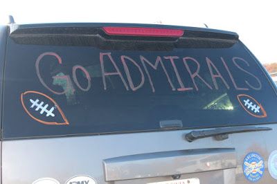 a car with stickers on the back that says go admirals and has football written on it