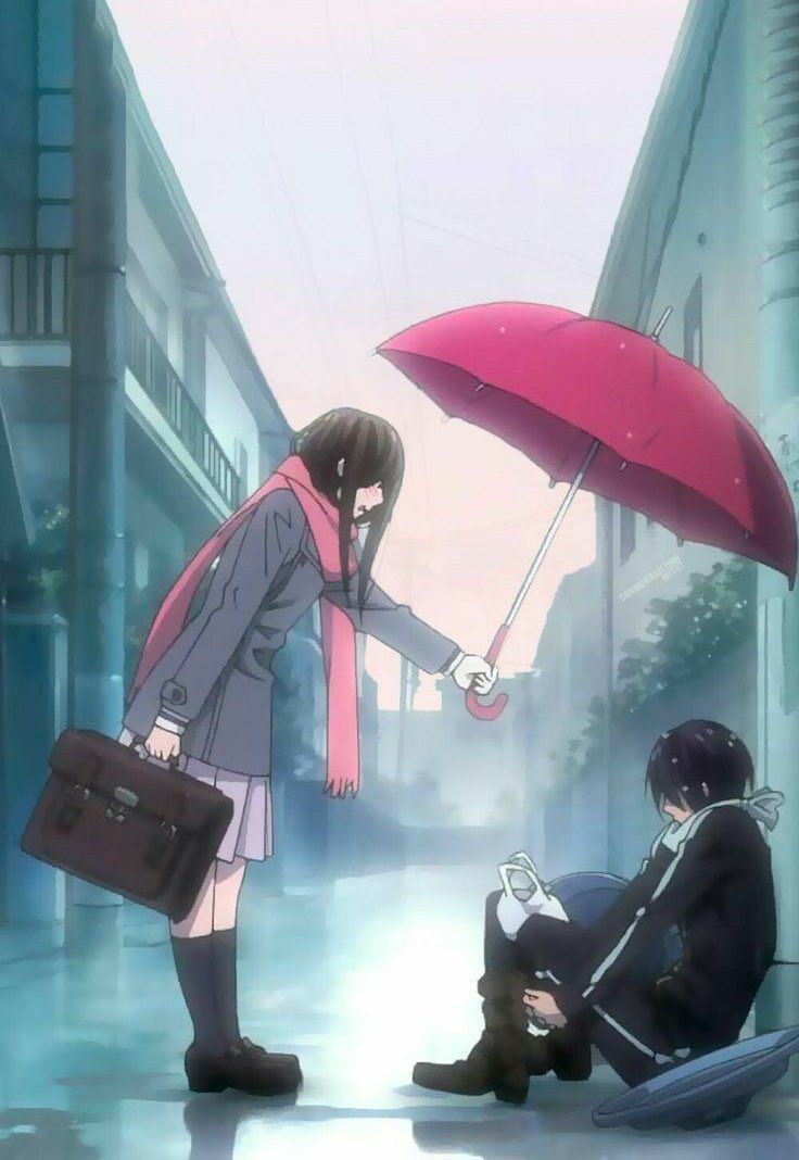 two people sitting on the ground with umbrellas over their heads and one person holding a briefcase