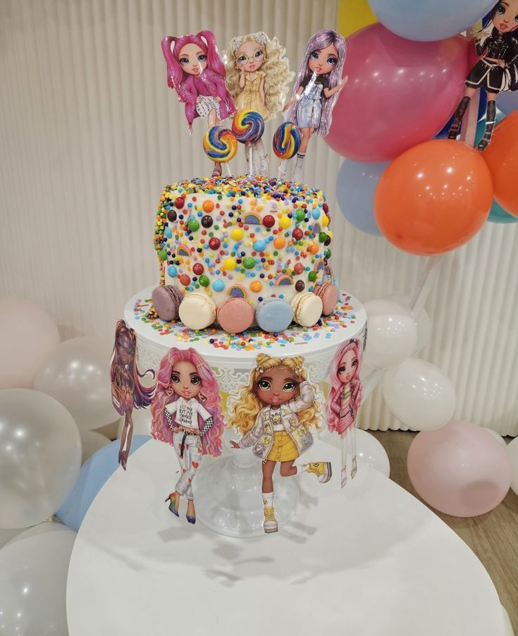 a birthday cake decorated with lollipops and candy