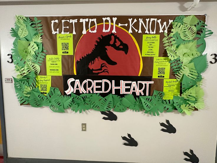 a bulletin board is decorated with paper leaves and cutouts to spell out the words, get to know sacred heart