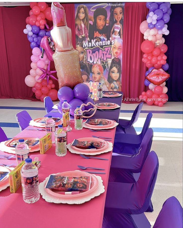 a table set up for a barbie birthday party