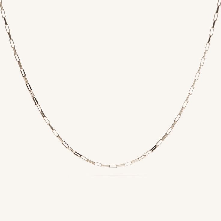 The Joy Necklace is a small yet brilliant square link necklace designed to reflect light and catch your eye brilliantly. Add this piece to your collection for an added layer of glimmer that will stand the test of time. Can't get enough of this beautiful piece? Shop the silver version of the Joy Necklace here, as well as the gold and silver matching bracelets. 14k Gold Fill Length: 17" Pieces from this collection are not eligible for any discounts or promotions Sterling Silver Rectangular Necklace With Delicate Chain, Elegant Square Chain Necklace As Gift, Modern Rectangular Paperclip Chain Necklace, White Gold Rectangular Box Chain Necklace, White Gold Necklace With Rectangular Links As Gift, Silver Delicate Chain Rectangular Necklace, Silver Rectangular Delicate Chain Necklace, Silver Necklace With Rectangular Delicate Chain, Silver Necklace With Delicate Rectangular Chain