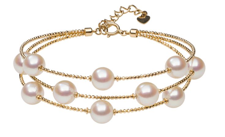 Ten lustrous petite Akoya Pearls are scattered across three strands of a sparkling 18 karat gold wire bracelet in this unique design. Featuring a one-inch extender, adjust this piece easily for different wrist sizes. Simultaneously contemporary and classic, slip this striking bracelet on your wrist to enhance every out Luxury Multi-strand Yellow Gold Jewelry, Elegant Multi-strand Yellow Gold Jewelry, Elegant Yellow Gold Multi-strand Jewelry, Adjustable Yellow Gold Multi-strand Jewelry, Adjustable Multi-strand Yellow Gold Jewelry, Elegant Adjustable Multi-strand Jewelry, Elegant Formal Chain Bracelet With Extender, Elegant Yellow Gold Chain Bracelet With Extender, Elegant Adjustable Gold Bracelet With Round Beads