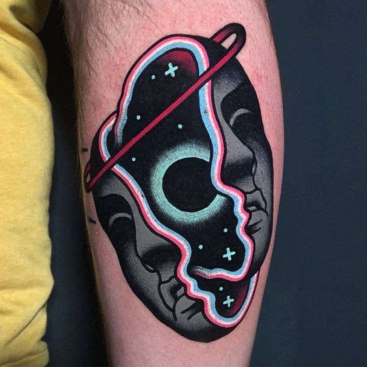 a man's arm with a tattoo on it that has a skull in the middle