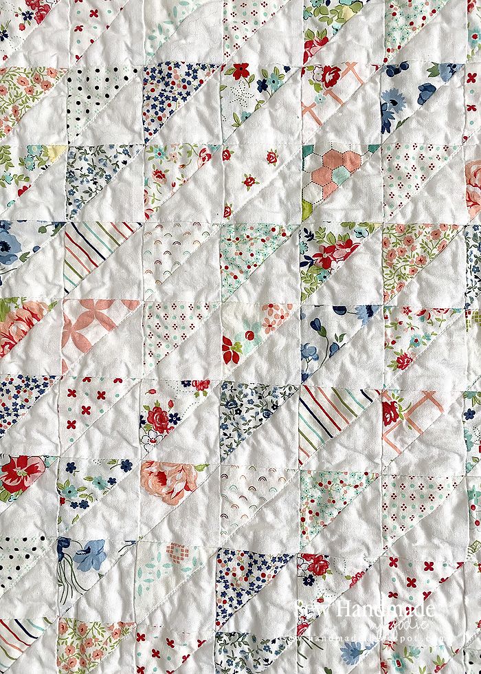 an old quilt with many different designs on it