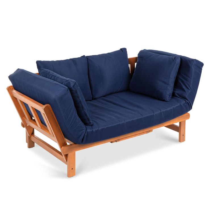 a blue couch sitting on top of a wooden frame