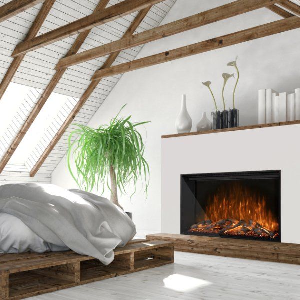 a bedroom with a bed and fireplace in the corner, surrounded by wooden beams that have been built into the wall