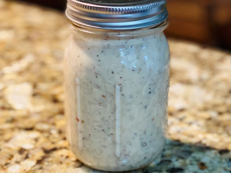 a jar filled with food sitting on top of a counter