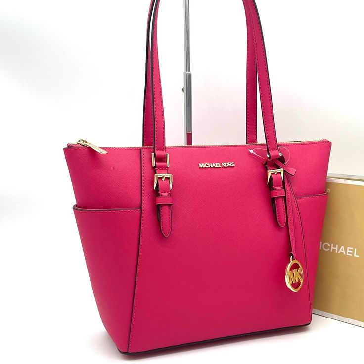 Brand New With Tag Charlotte Large Saffiano Leather Top-Zip Tote Bag Color: Electric Pink Tote Bag Saffiano Leather Gold-Tone Hardware 15"W X10"H X 4.75"D Handle Drop: 10" Exterior Details: 2 Side Slip Pockets Interior Details: Back Zip Pocket, 2 Front Slip Pockets Lining: 100% Polyester Zip Fastening Pink Saffiano Leather Shoulder Bag For Travel, Classic Pink Saffiano Leather Bags, Pink Saffiano Leather Rectangular Shoulder Bag, Rectangular Pink Saffiano Leather Shoulder Bag, Pink Saffiano Leather Bag With Removable Pouch, Luxury Pink Saffiano Leather Bag, Luxury Pink Saffiano Leather Shoulder Bag, Pink Saffiano Leather Bags With Branded Hardware, Modern Pink Michael Kors Bag