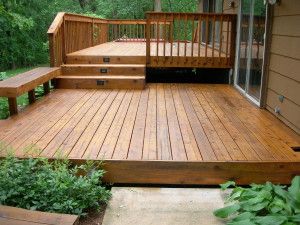 a wooden deck with steps leading up to it