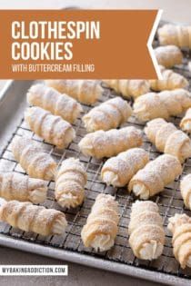 freshly baked croissant cookies with buttercream filling on a baking sheet and text overlay