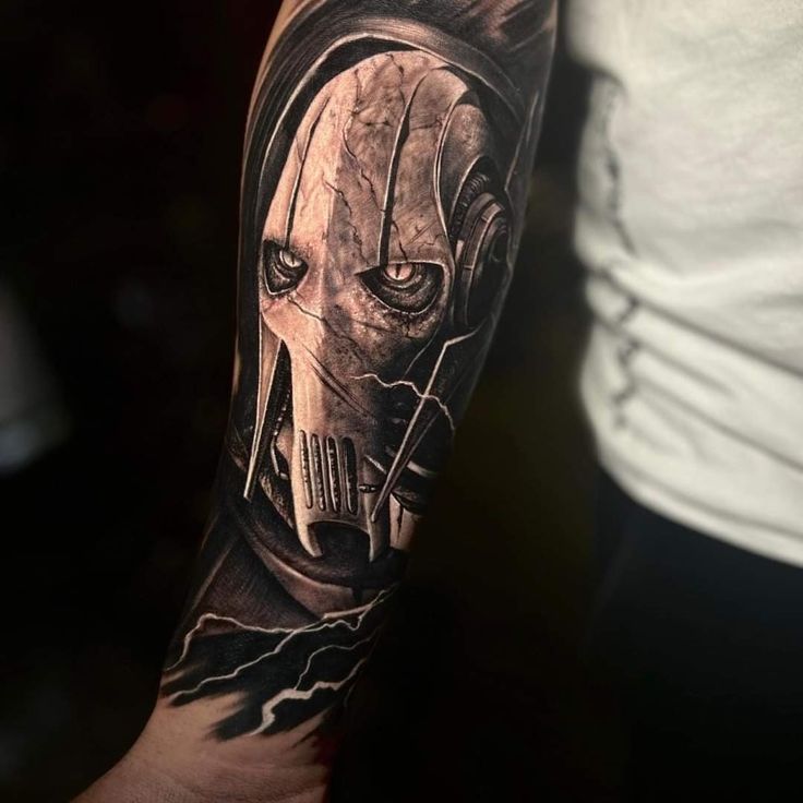 a man's arm with a tattoo on it that has an image of darth vader