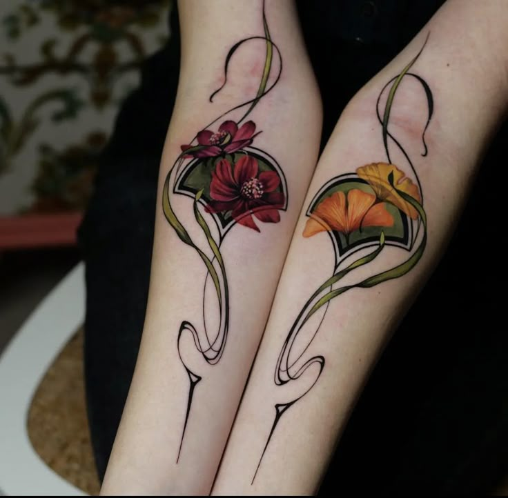 two tattoos with flowers on their legs