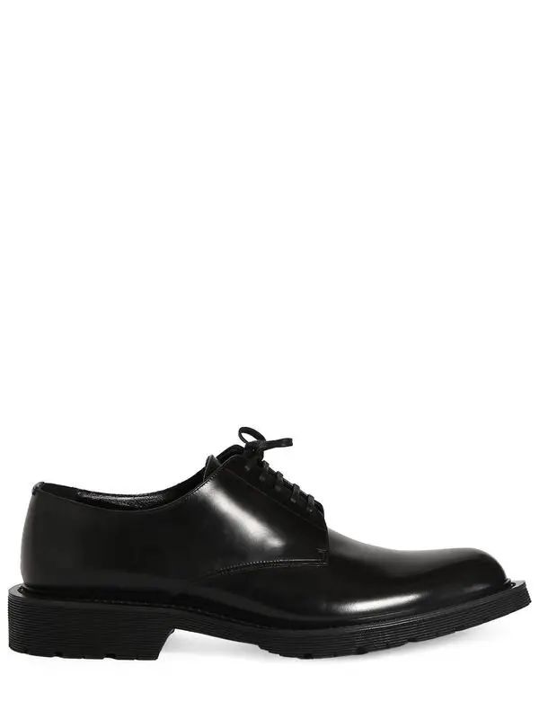 Saint Laurent Army 20 Leather Derby Shoes - Black | Editorialist Formal Oxford Shoes With Lace-up Fastening, Formal Lace-up Oxfords With Front Fastening, Low-top Leather Shoes With Laces For Formal Occasions, Formal Low-top Leather Shoes With Laces, Low-top Leather Shoes For Formal Occasions, Plain Toe Oxfords With Lace-up Fastening For Derby, Plain Toe Oxfords With Front Lace-up For Derby, Formal Lace-up Shoes With Round Toe, Designer Lace-up Oxfords For Work