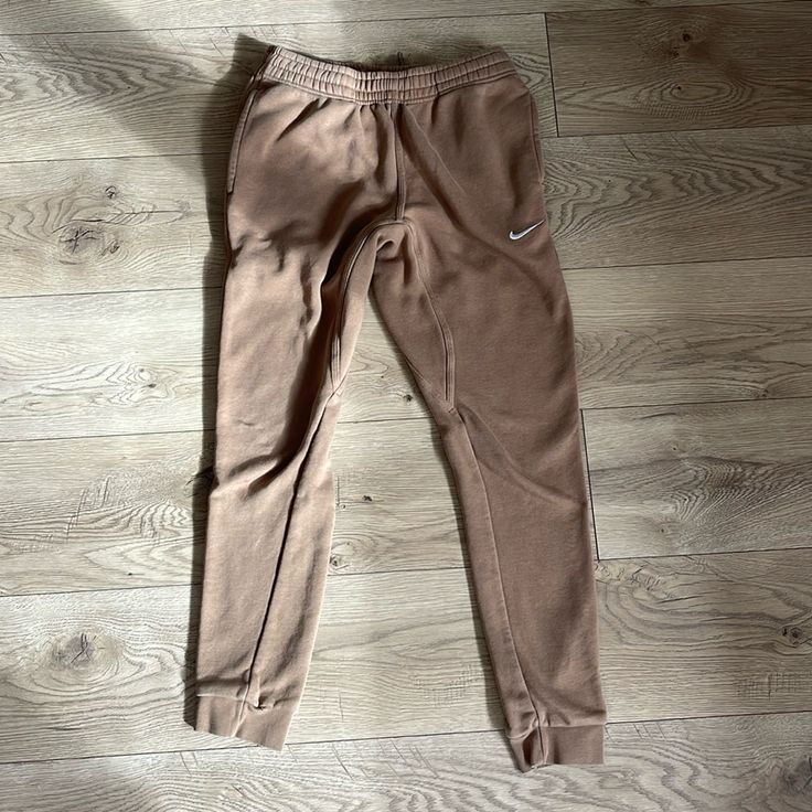 Nike High Waisted Tan Sweatpants With Pockets And Functioning Drawstring. New Without Tags. Nike Cotton Loungewear Bottoms, Nike Cotton Bottoms For Loungewear, Nike Cotton Long Pants, Nike Pants With Elastic Waistband For Loungewear, Nike Stretch Pants For Loungewear, Nike Jogger Trousers For Loungewear, Nike Bottoms With Elastic Waistband, Nike Sweatpants For Loungewear, Nike Relaxed Fit Trousers