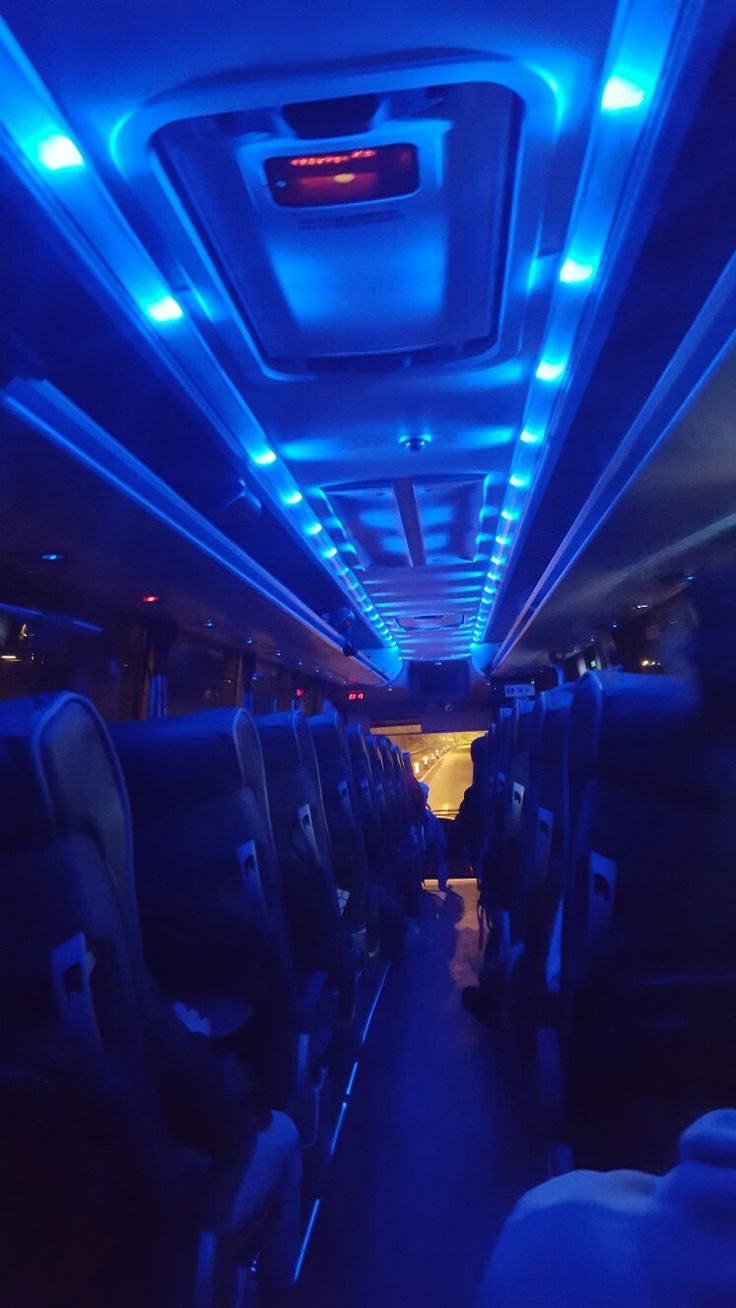 the inside of an airplane with blue lights