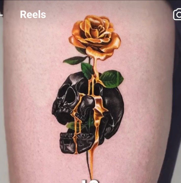 there is a tattoo on the thigh of a person that has a rose in it