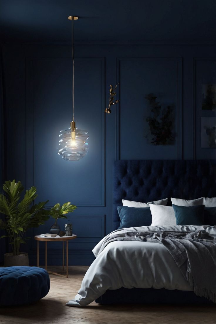 a bedroom with dark blue walls and furniture