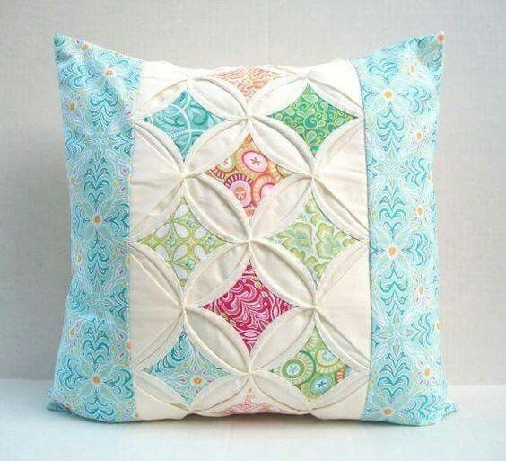 a decorative pillow made out of quilted material