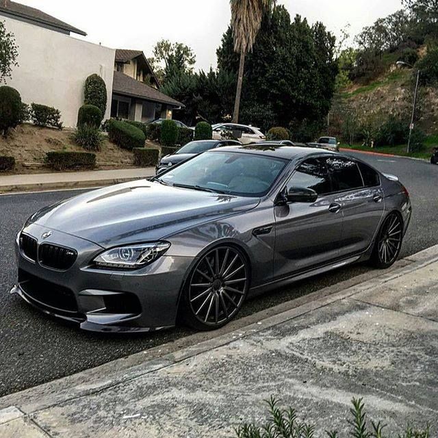 a silver car parked on the side of a road