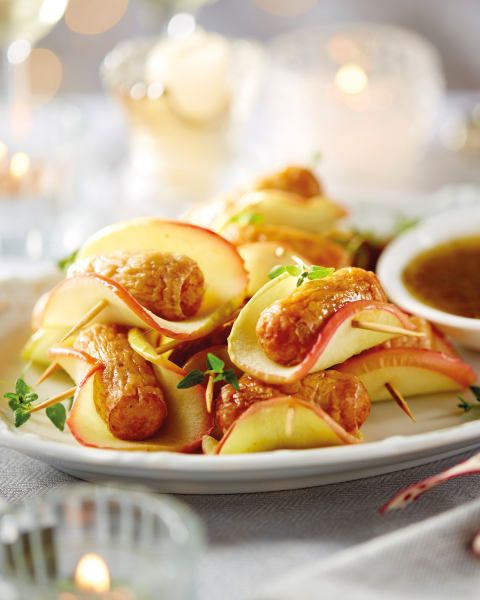 a white plate topped with apples covered in sauce