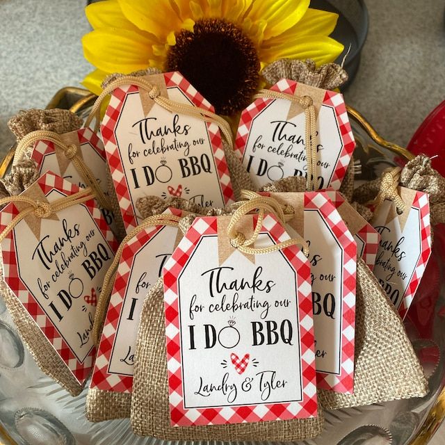 there are many tags that say i do bbq and have sunflowers in the background